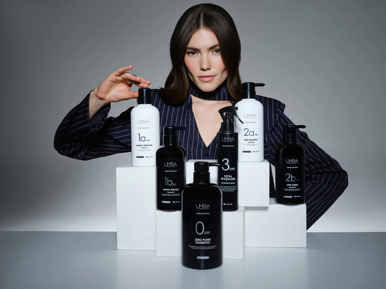 Model with the six Limba Repair Protocol salon bottles